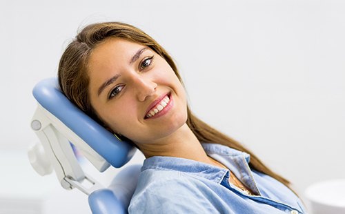 Woman after using dental insurance in Delafield