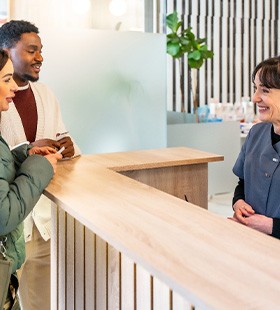 Patient paying a portion of teeth whitening treatment