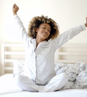 Woman stretching after waking up
