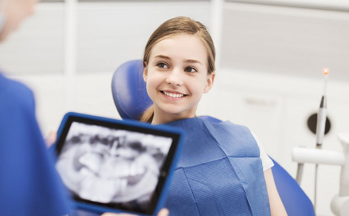 Young girl smiling while receiving pediatric dentistry in Delafield