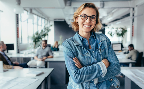 Female professional smiling after tethered tissue release in Delafield