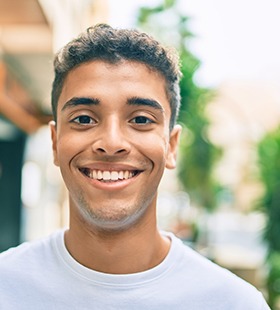 Teenage boy smiling after Invisalign Teen treatment in Delafield