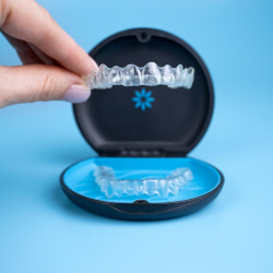 An Invisalign aligner in a protective case