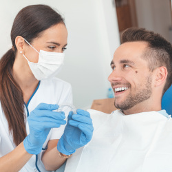 Male patient meeting with dentist for routine check-in