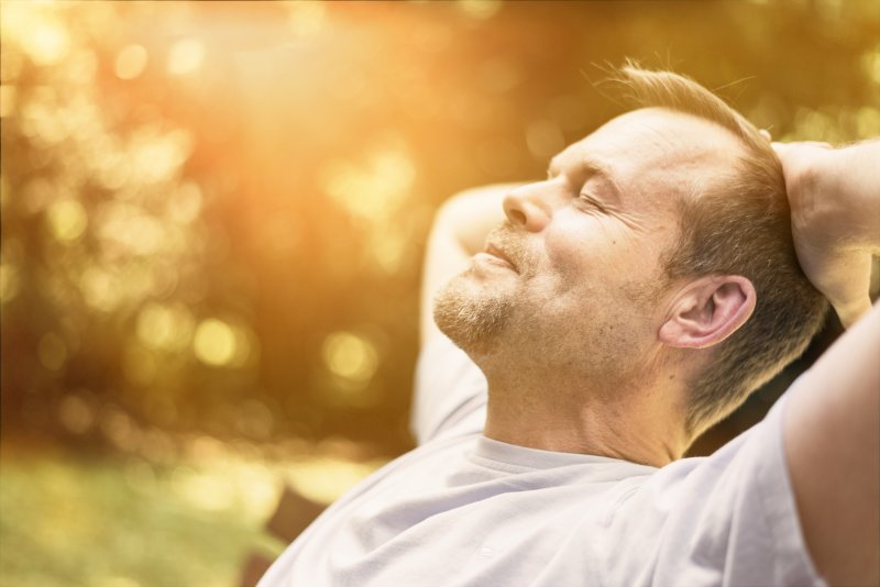 a man enjoying the outdoors and smiling